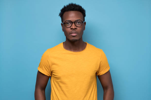 istock Smart young african american man in glasses looking confident at camera 1225231698