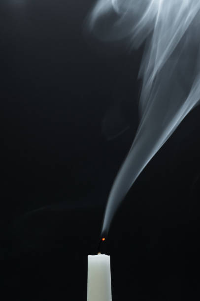 Smoking white candle Smoking white candle after blowing out extinguishing photos stock pictures, royalty-free photos & images