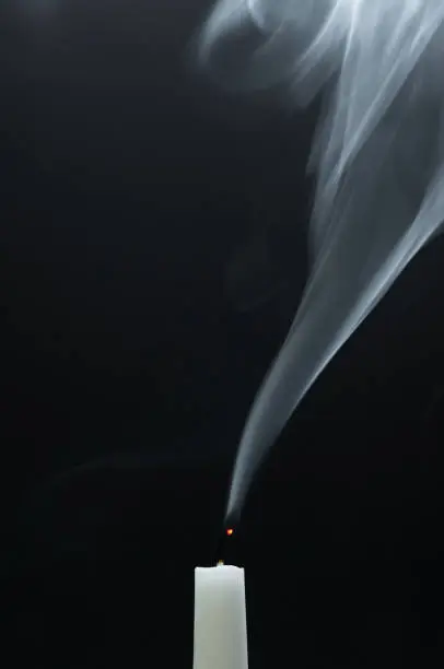 Photo of Smoking white candle