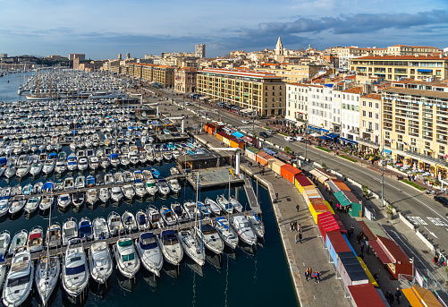 Scenic aerial view of the Vieux Port de Marseilles (old port) and Le Panier quarter on the right viewed from the observation wheel. Marseille, France, January 2020