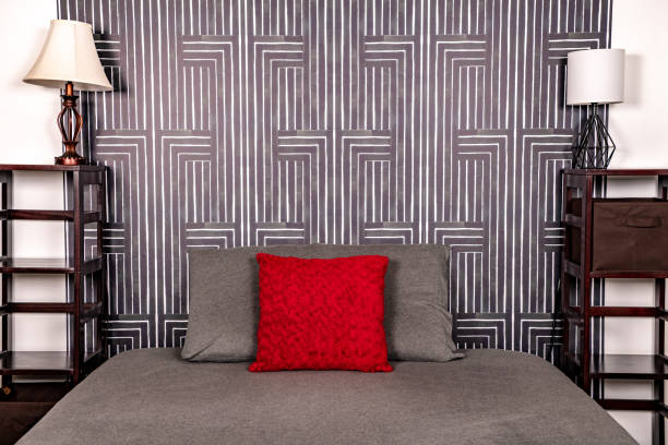 istock Modern gray bedroom with red pillow. Landscape view half bed. 1225235328