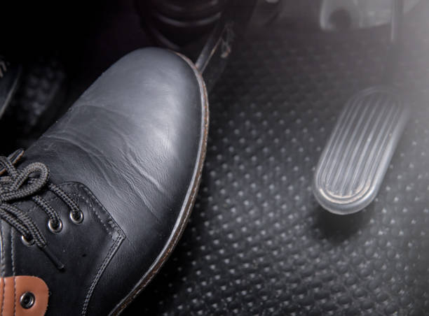 istock Human brake pedal car 1225236584