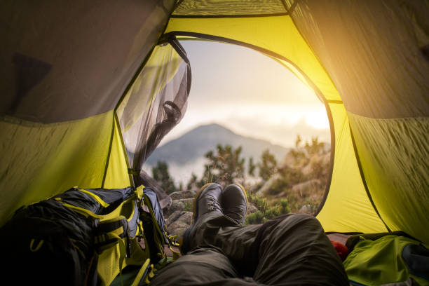 istock A traveler meets dawn in a tent. 1225241215