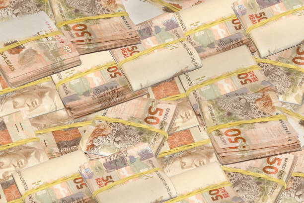 istock Brazilian money tied and piled 1225242763