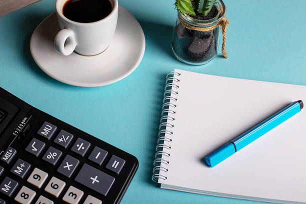 istock Top view office table with paper and coffee and calculator 1225243042