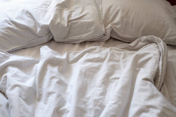 istock crumpled bed background after sleeping on it in hotel 1225245403