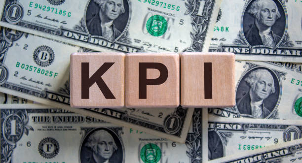 istock Concept word 'KPI' on cubes on a beautiful background from dollar bills. 1225246137