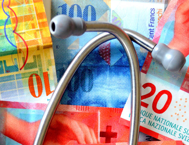 costi sanitari in svizzera. - currency stethoscope healthcare and medicine savings foto e immagini stock