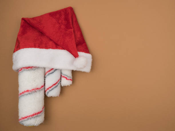 istock Paint rollers in Santa's hat. Christmas repair tool. 1225252289