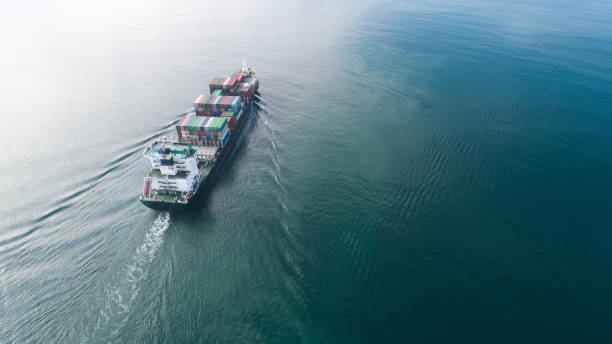 istock Large container ship at sea. Aerial top view of cargo container ship vessel import export container sailing. 1225257082