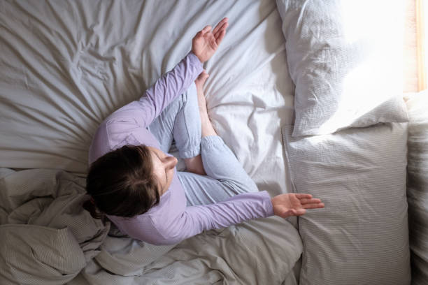 istock Young beautiful woman doing meditation on bed 1225257915