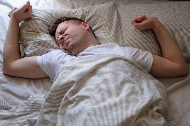 istock Young caucasian man trying to wake up 1225257956