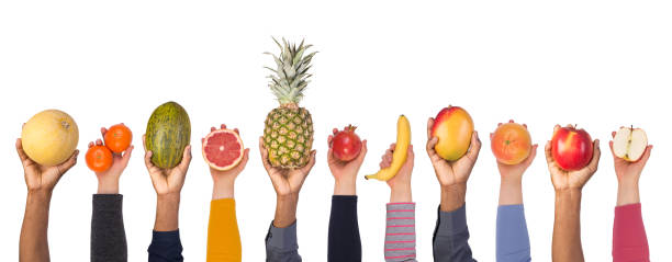 Fresh fruits in hands isolated on white background