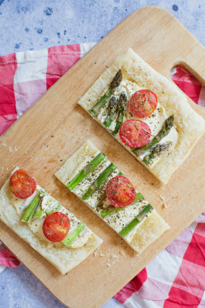 istock Pie with asparagus, cheese and tomatoes 1225262283