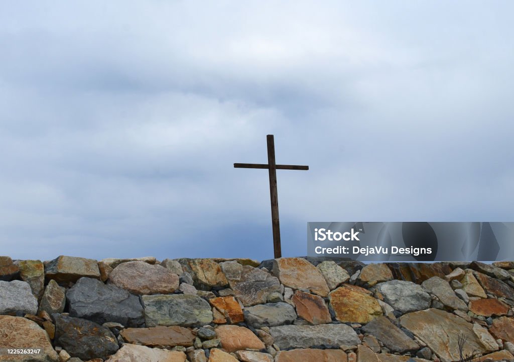 Wood Cross Along the Coastline in Scituate. Wooden cross at wall in Cedar Point Scituate Massachusetts. Beach Stock Photo