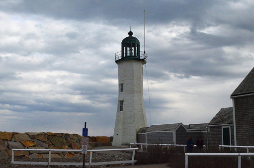 Towering view of a Old Scituate Light in Scituate Harbor.