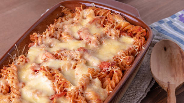 istock Classical Italian fusilli in a baking dish baked with tomato sauce and mozzarella and parmesan cheese 1225263377