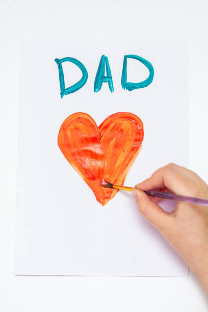 istock Child is drawing Father's day greeting card. 1225265694