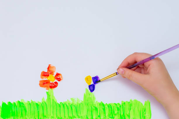istock Child is drawing flowers 1225265702