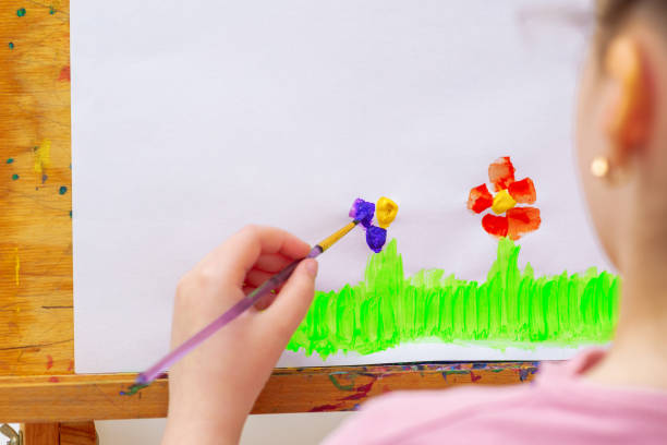 istock Child is drawing flowers 1225265746