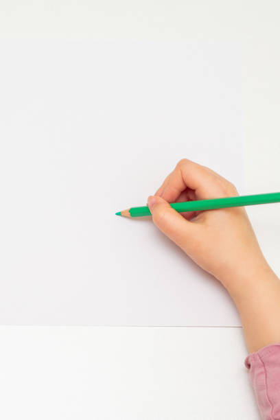 istock Kid is drawing on white blank paper. 1225265772