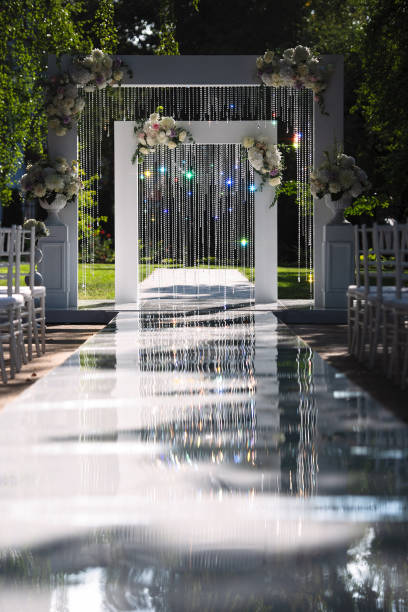 istock festive wedding decor, wedding arch decorations, sunlight shimmers in objects, arch decoration with flowers 1225268583