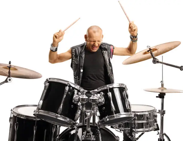 Photo of Bald man drummer starting to play drums
