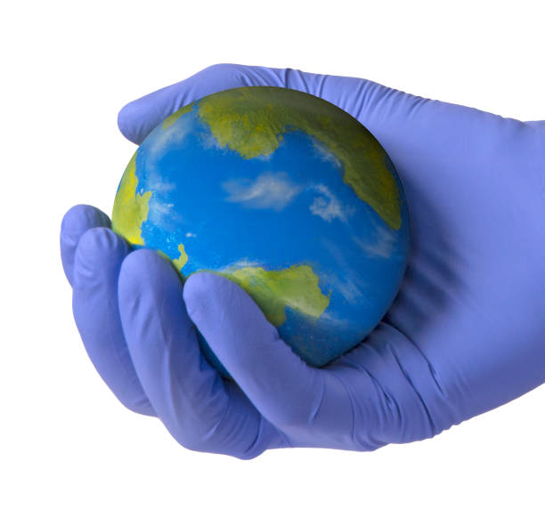 istock Medic holding protecting the planet earth in hands 1225272156