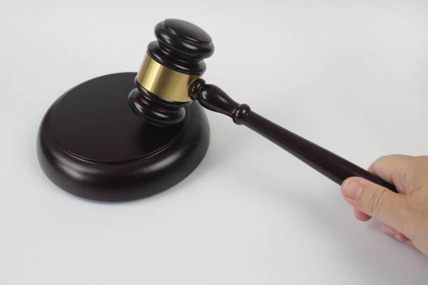 istock Hand holding a Wooden Judge hammer 1225272169