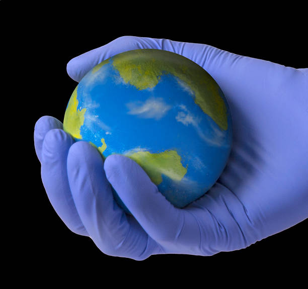 istock Medic holding protecting the planet earth in hands 1225272199