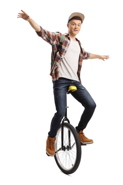 一輪車でジャグリング若い男子学生 - unicycle unicycling cycling wheel ストックフォトと画像