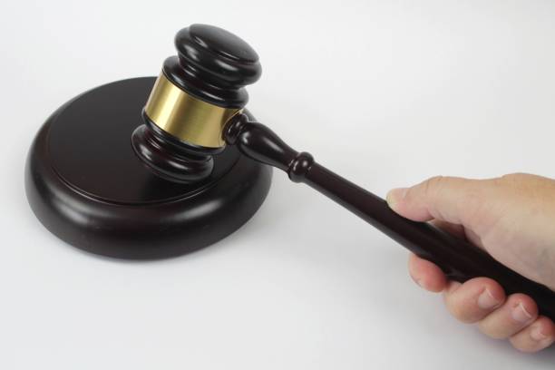 istock Hand holding a Wooden Judge hammer 1225272317