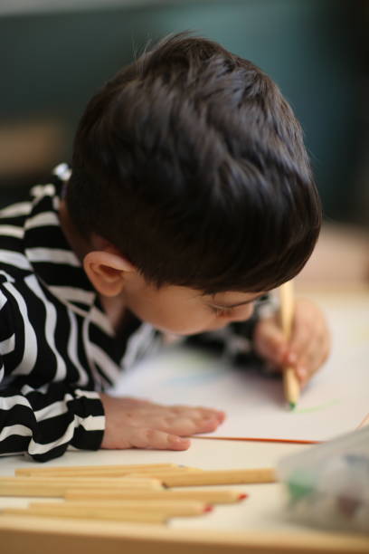istock Little boy painting 1225274149