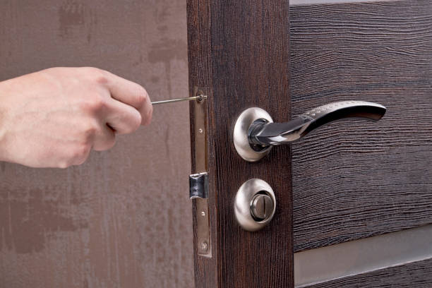 istock person fixing door furniture using screwdriver. improvement process. 1225274238