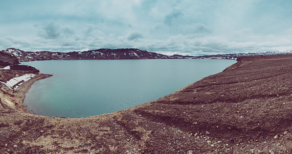 Oskjuvatn blue lake in caldera of Askja volcano crater in Iceland, travel north landscape. Panoramic view