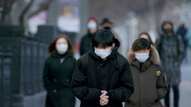istock CoronaVirus. Quarantine Crowd. Epidemic People Protect Masks. Lockdown Pandemic. 1225277088