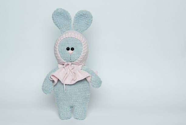 istock Soft toy knitted bunny. Plush crocheted bunny. 1225277345