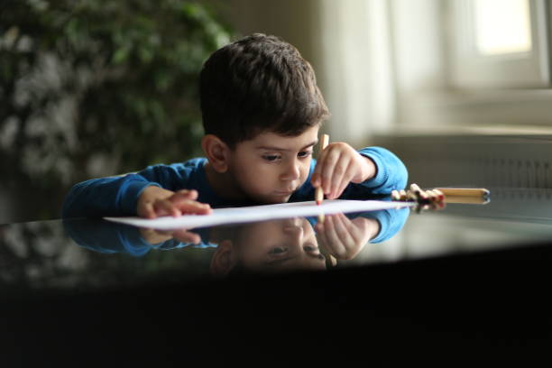 istock Adorable little boy, drawing picture 1225278181