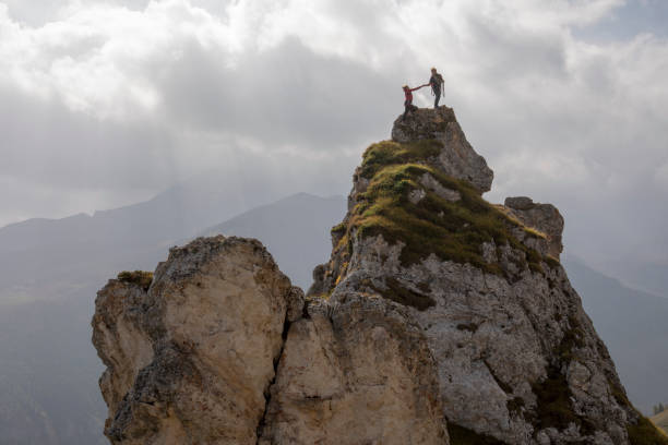 istock Friends relax on mountain summit 1225278199