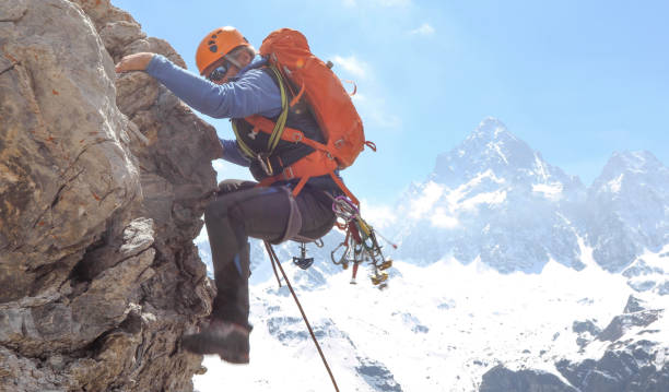 istock Mountaineer climbs up mountain face 1225278968