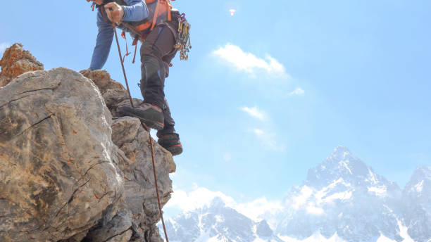istock Mountaineer climbs up mountain face 1225279091