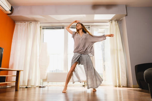 istock Woman dance at self isolation at home 1225280756