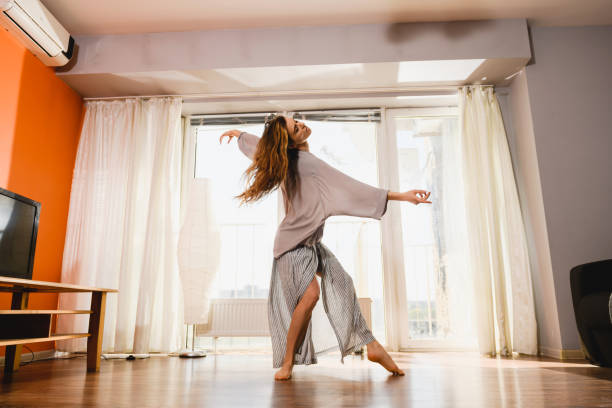 istock Woman dance at self isolation at home 1225280764