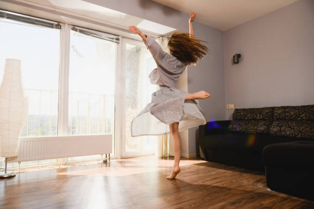 istock Woman dancing at home at isolation time 1225280776