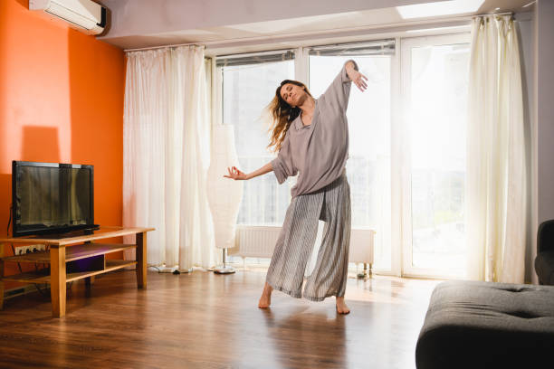 istock Woman dancing at home at isolation time 1225280909