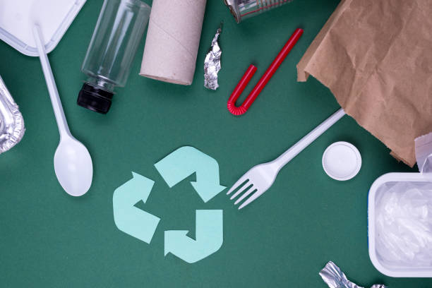 istock Reuse reduce recycle flat lay concept with plastic, paper, and polyethylene waste. Ecology background image with recycling symbol. 1225281850