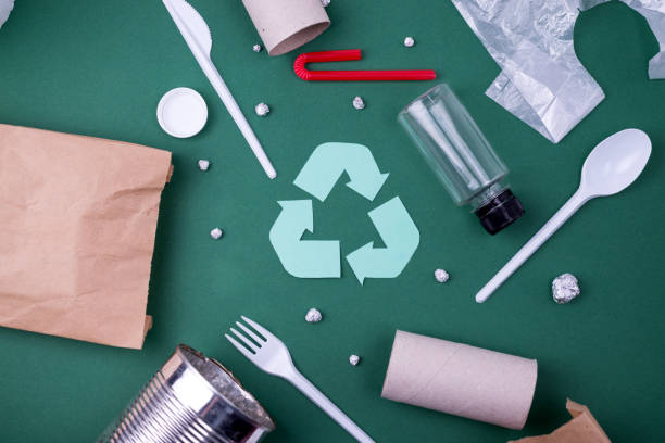 istock Reuse reduce recycle flat lay concept with plastic, paper, and polyethylene waste. Ecology background image with recycling symbol. 1225281859