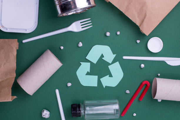 istock Reuse reduce recycle flat lay concept with plastic, paper, and polyethylene waste. Ecology background image with recycling symbol. 1225281882