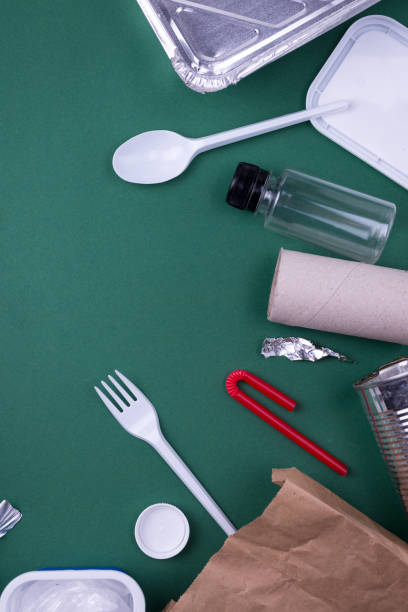 istock Reuse reduce recycle flat lay concept with plastic, paper, and polyethylene waste. Template image with copy space. 1225281901