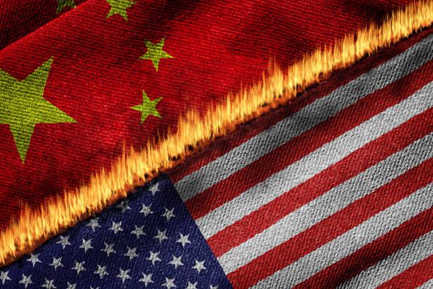 Concept of Conflict Showing Flags of USA and China on Fire Flags of USA and China on fire. Concept of conflict between the 2 countries due to trade dispute, disagreement over Covid-19 origin, and political differences. cold war photos stock pictures, royalty-free photos & images